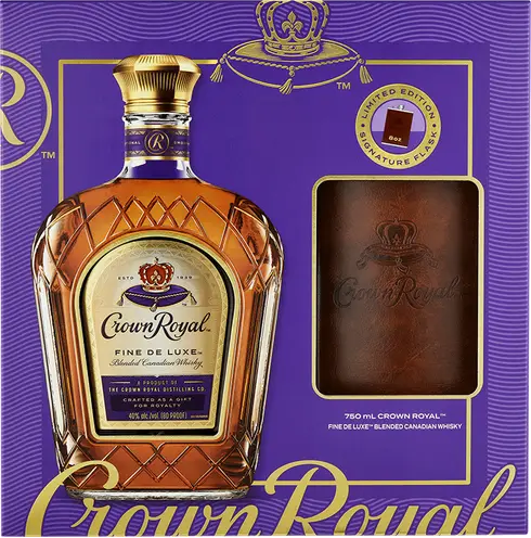 Crown Royal whisky bottle with packaging on a purple background