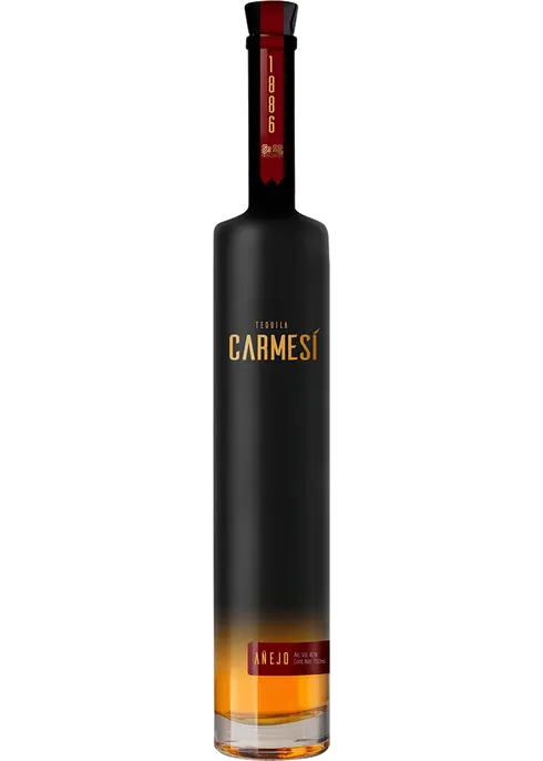 A bottle of Carmesi 1886 Anejo Tequila with a clear view of the label and cap. The bottle is tall with a dark color at the top and a transparent section at the bottom revealing the amber-colored liquid inside.