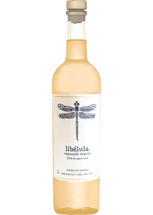 A bottle of Libelula Tequila Reposado with a dragonfly illustration on the label.