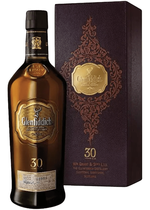 A bottle of Glenfiddich Scotch Single Malt 30 Year Old whisky, accompanied by a matching wooden gift box with intricate designs.