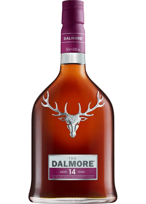 A bottle of The Dalmore 14 Year Single Malt Scotch Whisky with a distinctive silver stag logo on the label.