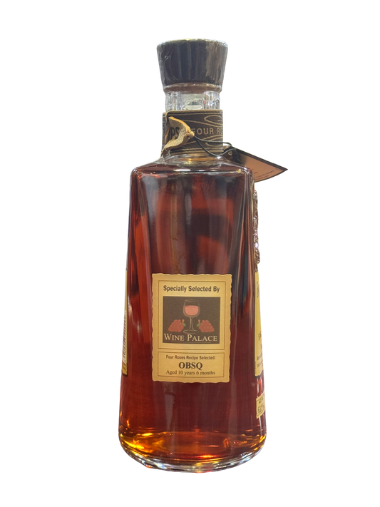 Bottle of OBSQ whiskey on a white background