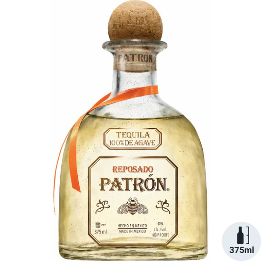 Patrón Reposado tequila bottle with cork stopper on a white background