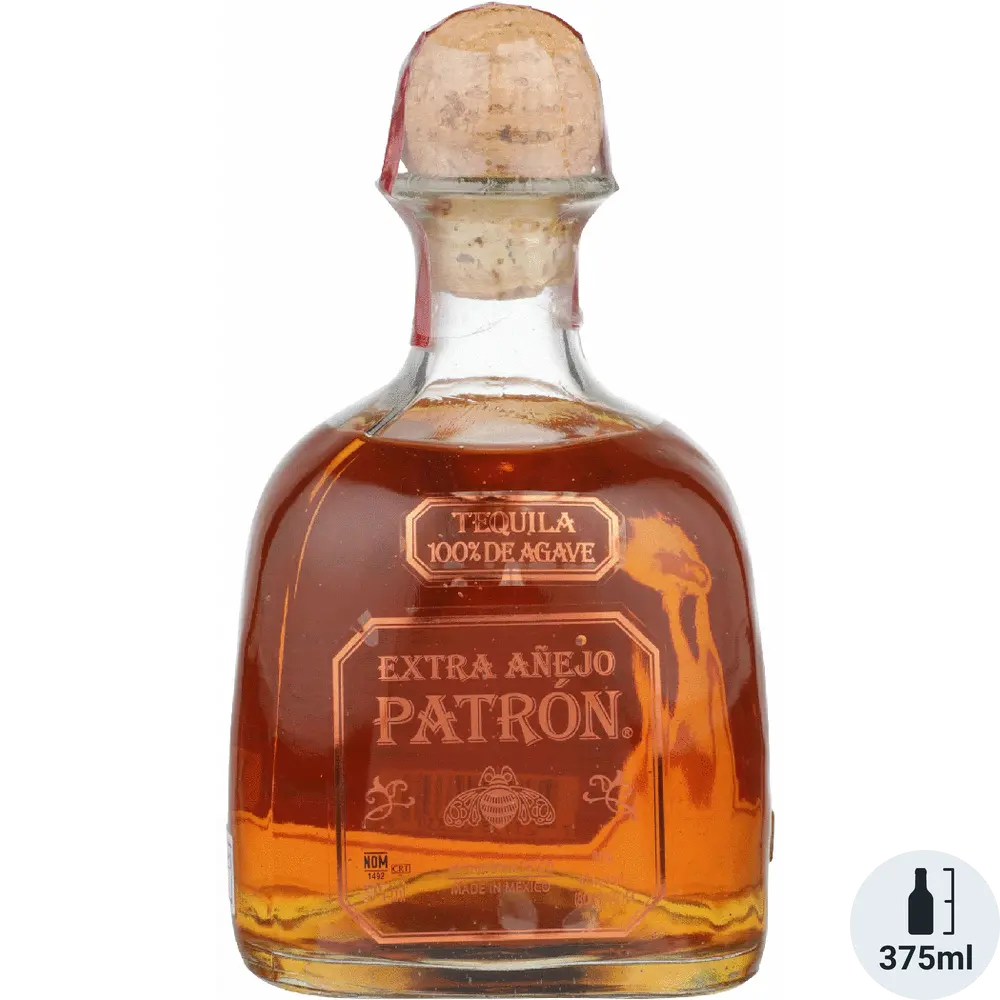 Patron Extra Añejo tequila bottle with cork stopper on a white background