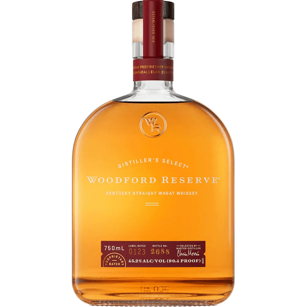 A bottle of Woodford Reserve Kentucky Straight Wheat Whiskey, with a label indicating it is a Dillinger's Select product. The whiskey appears to be a deep amber color and the bottle has a clear cap.