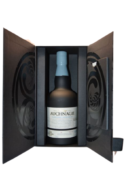 A bottle of Scotch whisky, labelled 'Auchnagie', presented in a black gift box with a glass front.