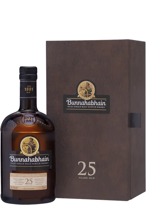 This image features the Bunnahabhain Single Malt Scotch 25 Year Old, presented in a stylish and sophisticated packaging. The whiskey bottle, distinguished by its dark label and prominent display of the brand name, sits next to a matching brown box that highlights its exclusivity and age.