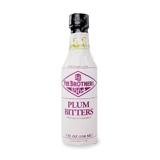 A bottle of Fee Brothers Plum Bitters with a white label, black cap, and green accents.