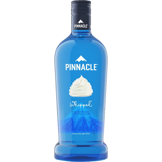 A bottle of Pinnacle Whipped non-alcoholic mint lemonade mixer, featuring a vibrant blue bottle with a white whipped cream graphic and a black cap, set against a plain white background.