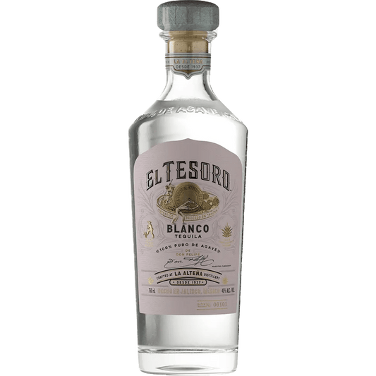 A bottle of El Tesoro Blanco Tequila with a beige cap and a label featuring the brand name and '100% Agave Highland'. The bottle is tinted with a grey background.