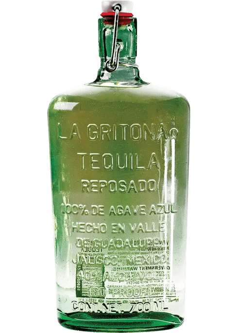 A clear glass bottle of La Gritona Tequila Reposado with a greenish tint and etched branding on the front.