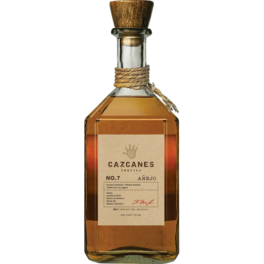 Bottle of Cazcanes tequila with a wooden cap on a white background
