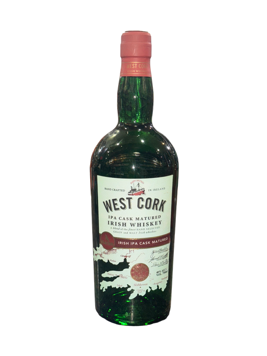 Green bottle of West Cork Irish Whiskey on a white background