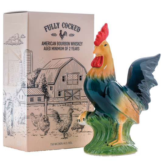Colorful rooster figurine in front of a 'Fully Cocked' whiskey box with a barn illustration.