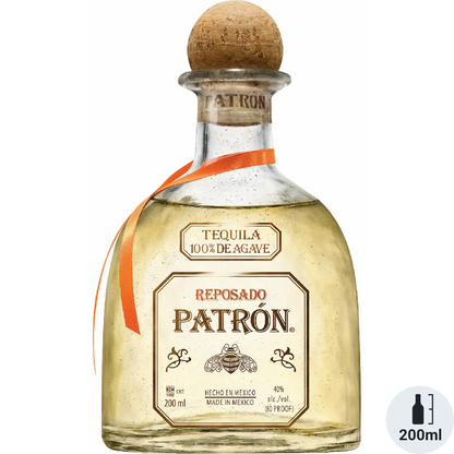 Patron Reposado tequila bottle with cork stopper on a white background