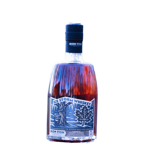 Bottle of Ice Storm Whiskey with a blue label on a white background