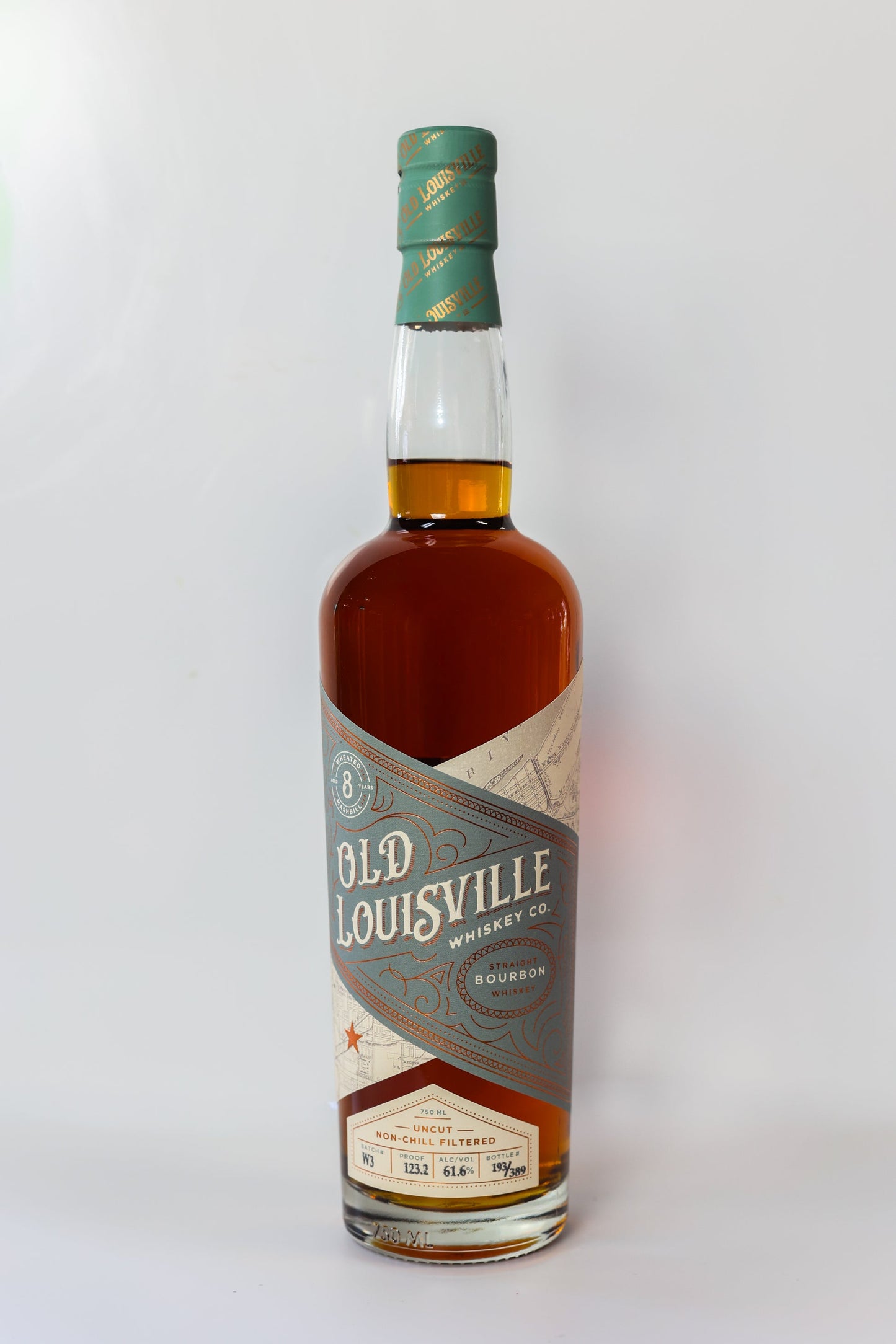 Bottle of Old Louisville Whiskey Co. bourbon on a white background