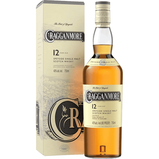 A bottle of Cragganmore Single Malt Scotch Whisky alongside its packaging box. The bottle has a beige label with the brand name and product details, while the box is cream-colored with similar text and branding.