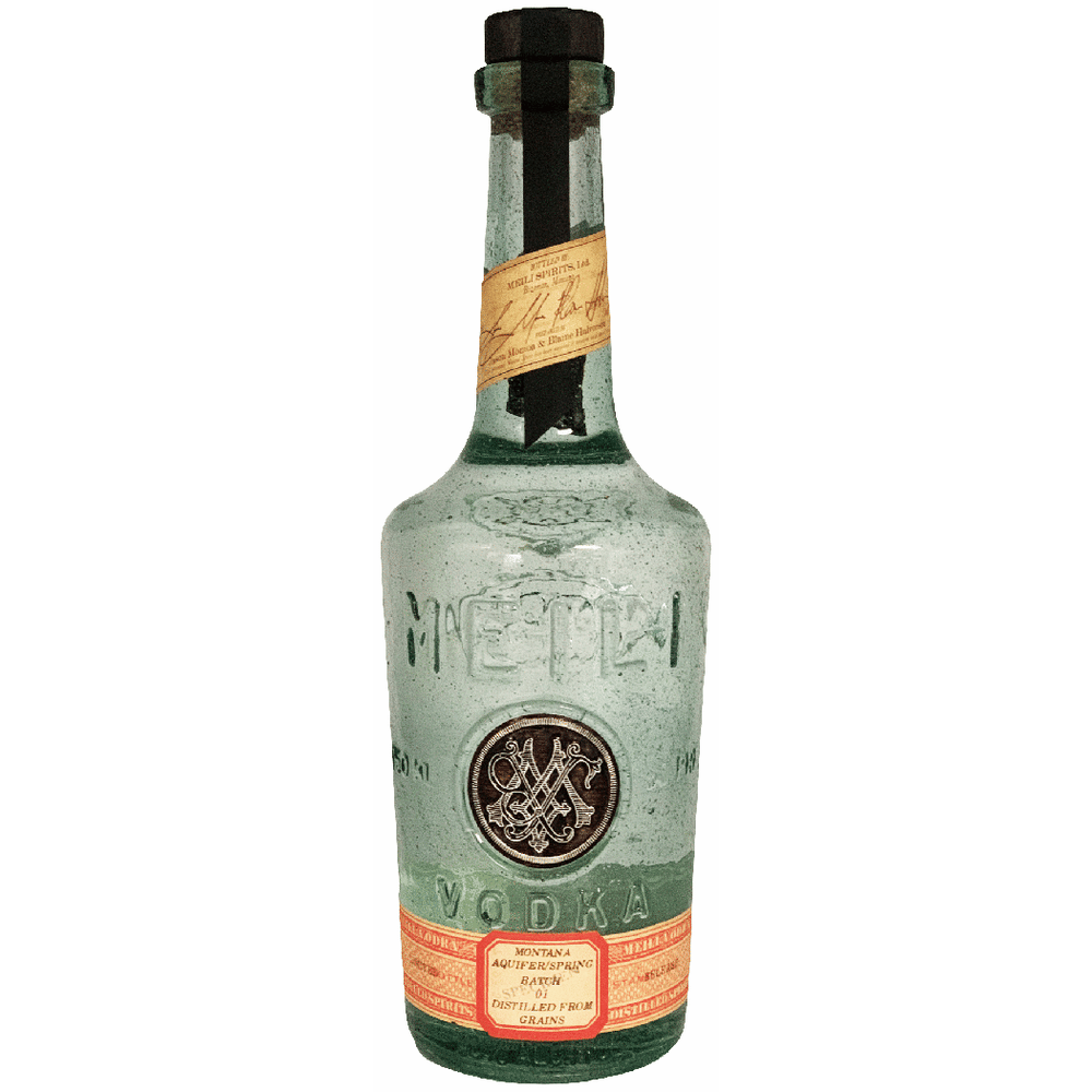 Vintage bottle of vodka with a label on a green background