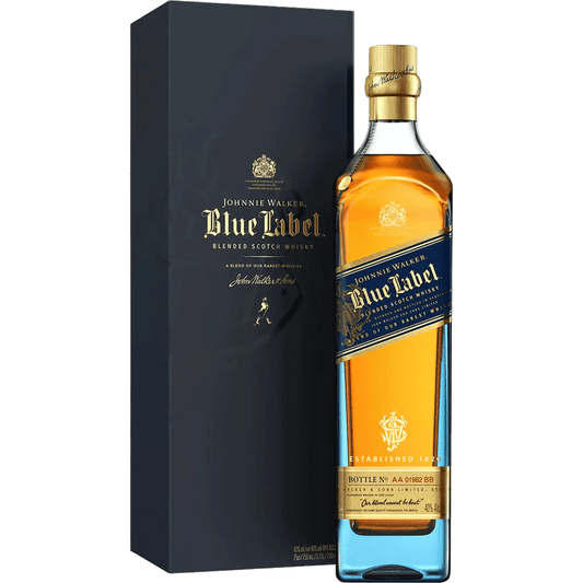 A bottle of Johnnie Walker Scotch Blue Label whisky, positioned in front of its packaging box. The bottle is tinted blue with a beige label, and the box has a similar color scheme with gold accents and text.