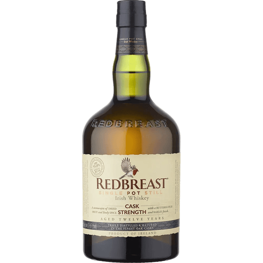 A bottle of Redbreast Cask Strength 12 Year Irish whiskey with a label showing the brand name and the maturation details.