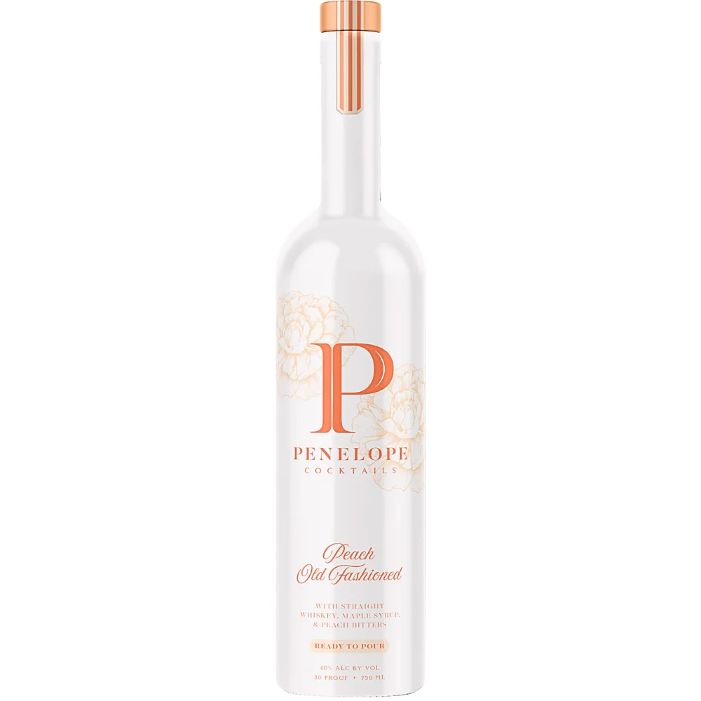 A bottle of Penelope Peach Old Fashioned cocktail mix, with a white label and orange accents, including an orange cap.