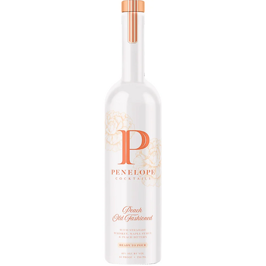 A bottle of Penelope Peach Old Fashioned cocktail mix, with a white label and orange accents, including an orange cap.